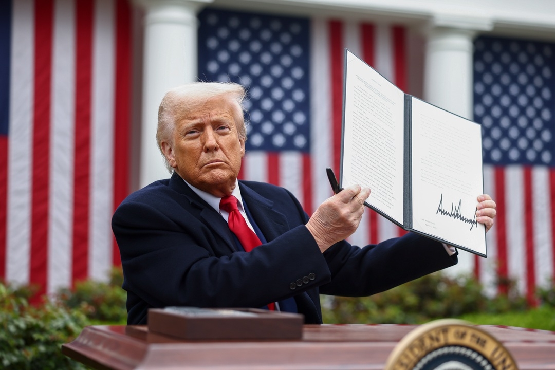 U.S. President Donald Trump displays a signed executive order during a tariff announcement at the White House in Washington on Wednesday. Photo: Bloomberg